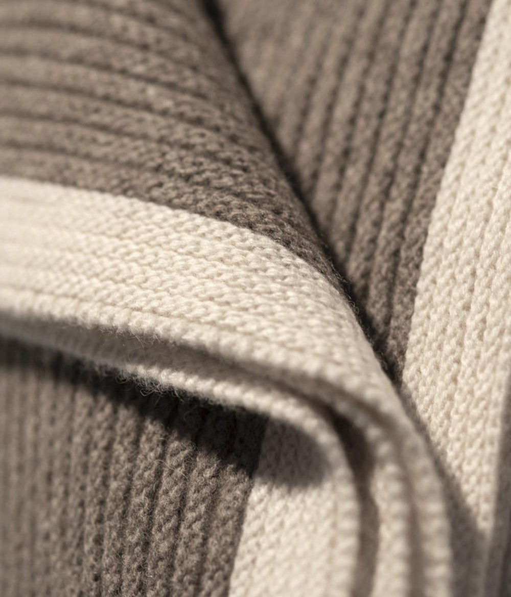 Soft and breathable yak down knit blanket perfect for cozy evenings and adding layers to your decor