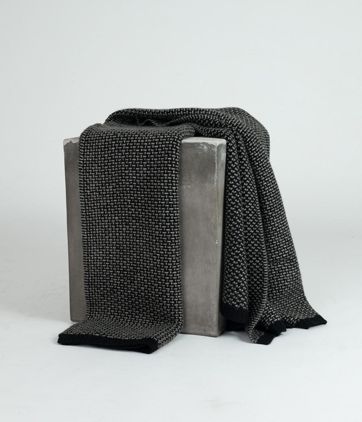 Mongolian handwoven platinum and black throw showcasing traditional craftsmanship