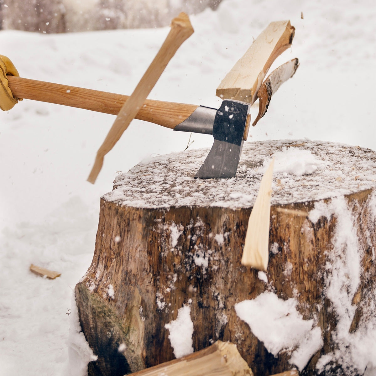 Gransfors Bruk Large Splitting Axe cutting wood in the snow