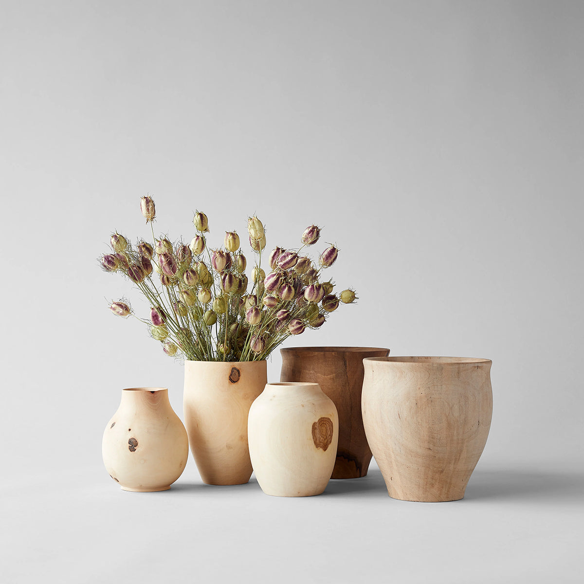 Carved walnut vases with smooth hand-finished surface from Morocco