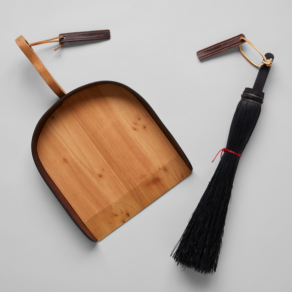 Fireplace broom with leather hanging loop and durable brass hardware