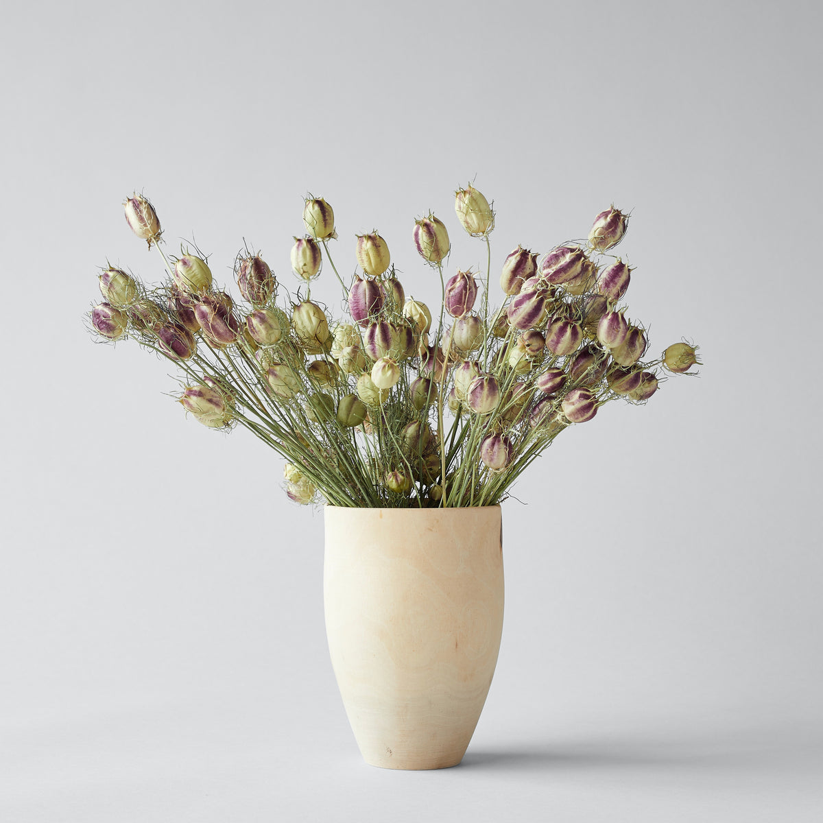 Handcrafted wooden tulip vase in raw white walnut