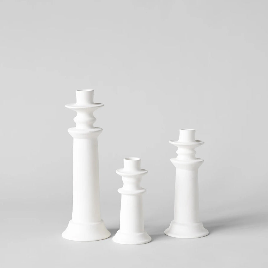 Set of white unglazed Moroccan candle holders in three heights