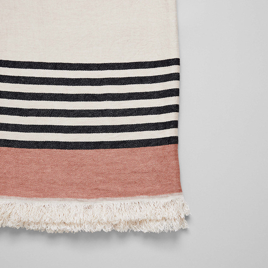 Inyo Belgian Linen Throw Blanket in black and blush tones woven in Meulebeke for bed or chair