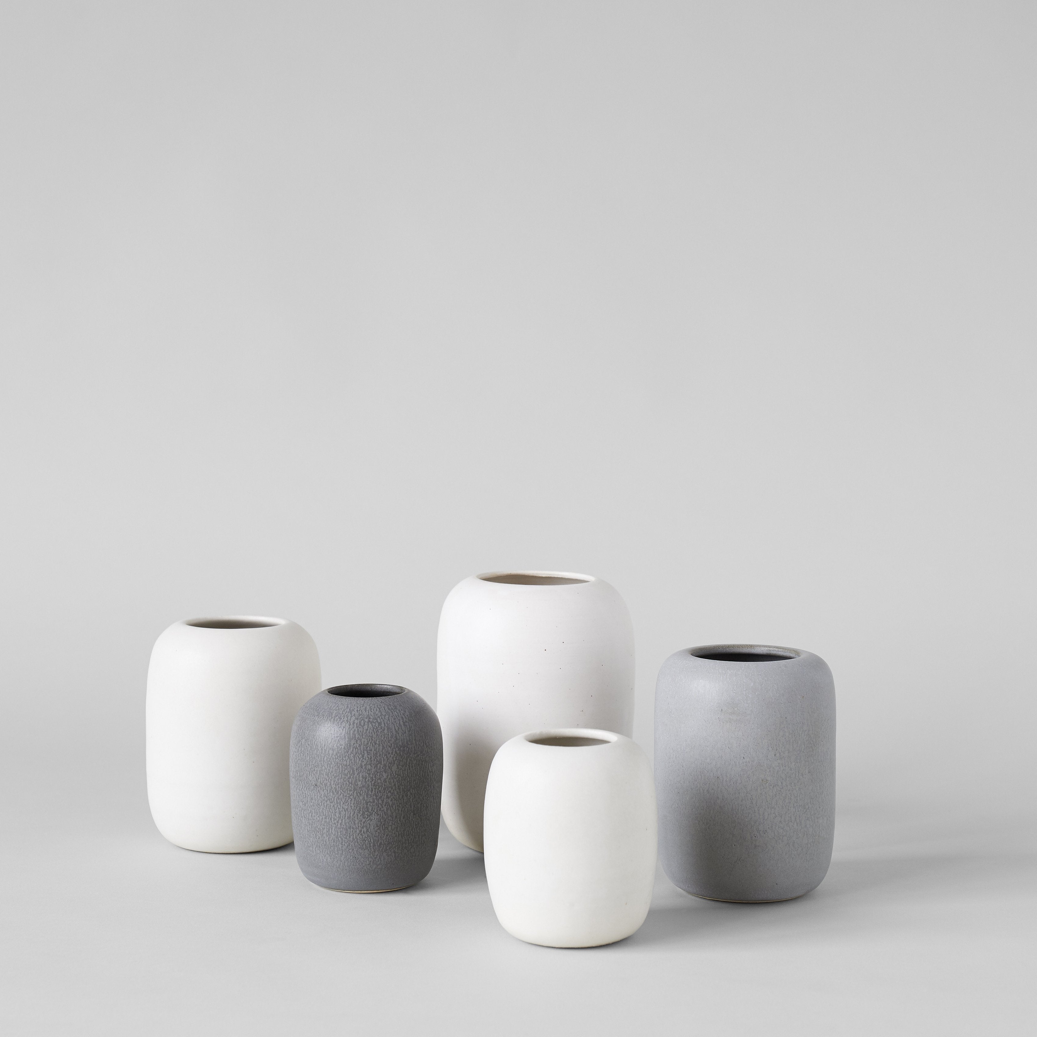 Handmade ceramic vases with rounded form and wide opening