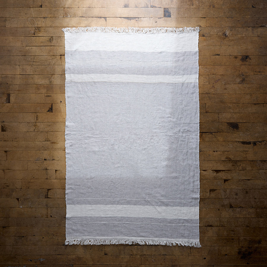 Lightweight ivory and grey linen throw from Belgium for layering on beds or chairs